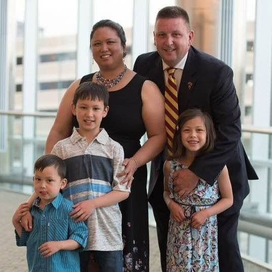 Stuart Halsall, Interim Vice Chancellor, Student Affairs, posing with his wife and three children