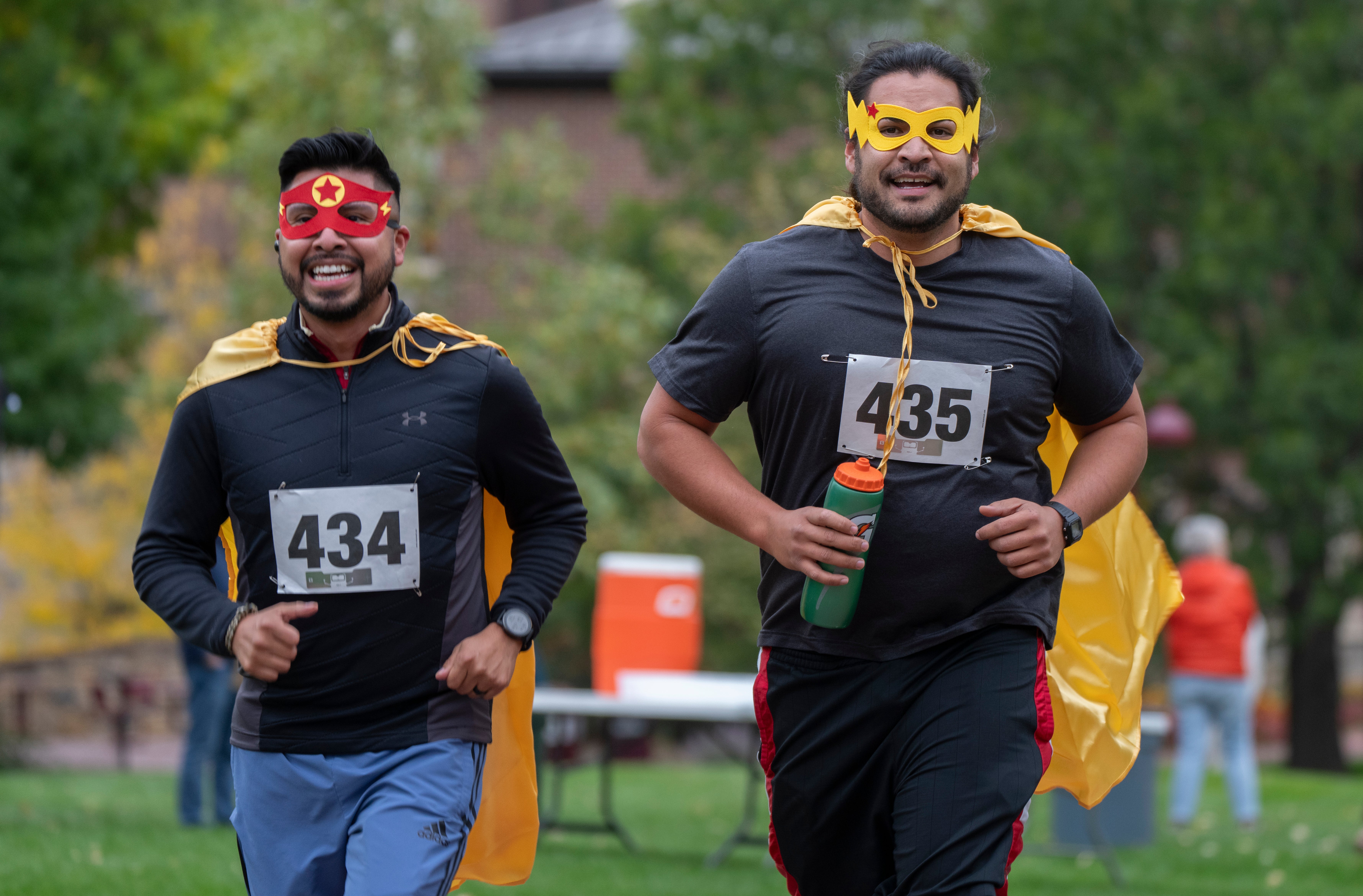 group of students running on campus
