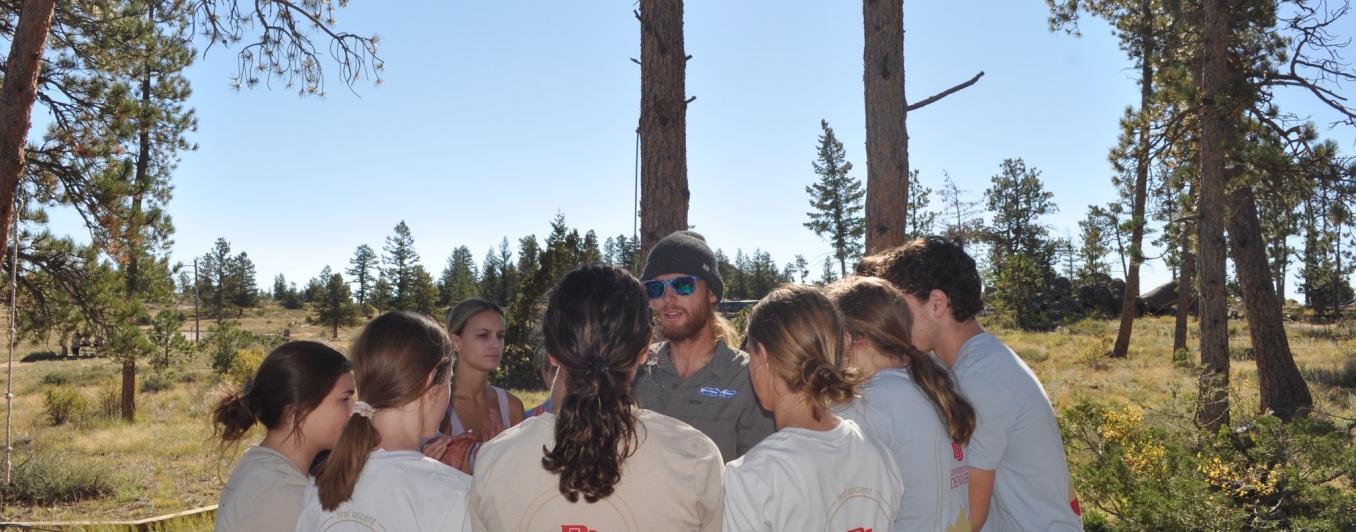 Students working on ropes course