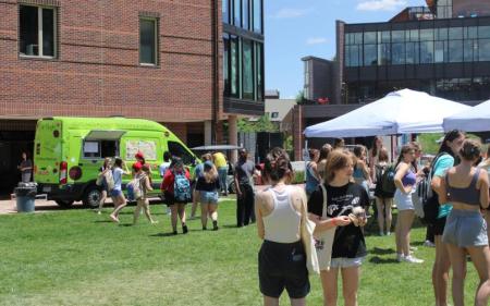 Students on the campus green at the University of Denver