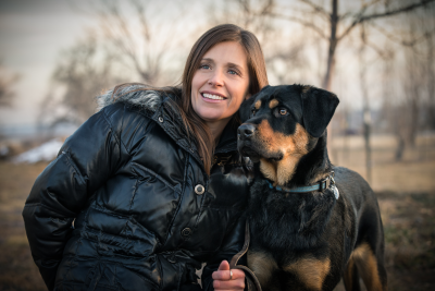 photo of Roxanne Turner wearing a jacket outside with a dog