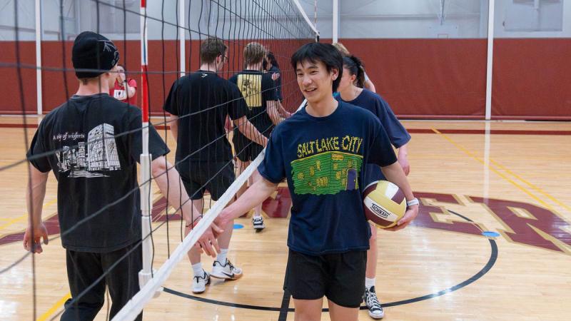 players shake hands after volleyball game