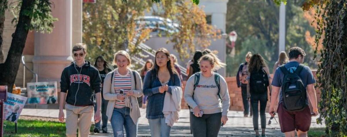 students walking across campus in fall term