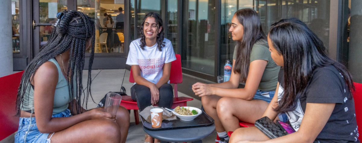 students eating lunch outside as a group