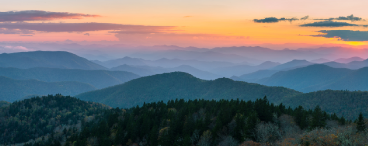 sunrise over low mountains