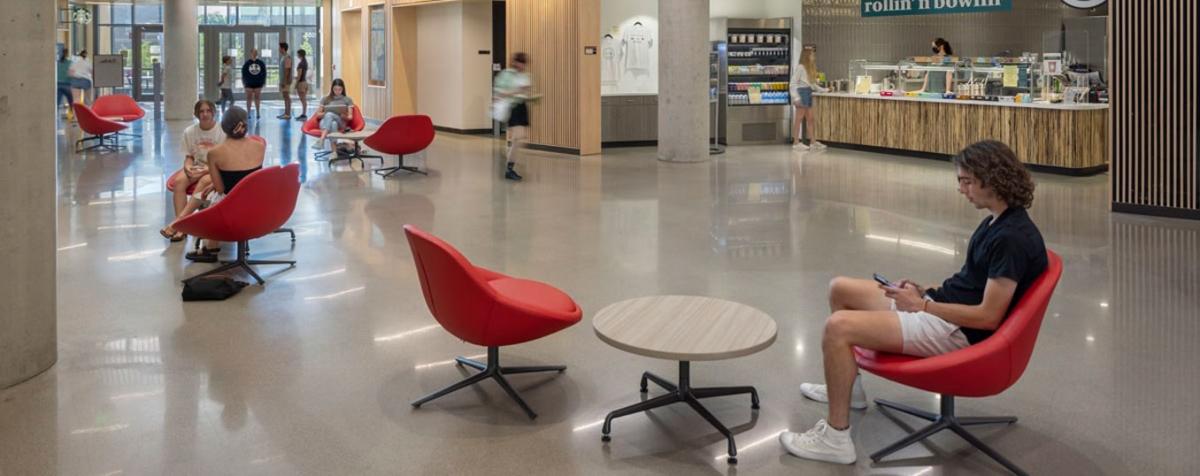 students sit in open seating at Community Commons