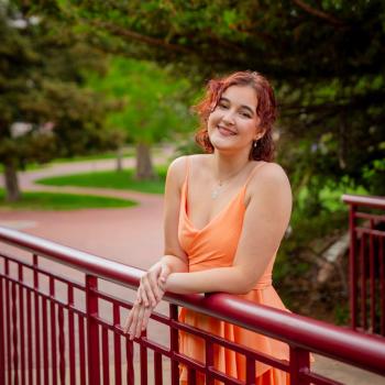 Photo of a person in an orange dress
