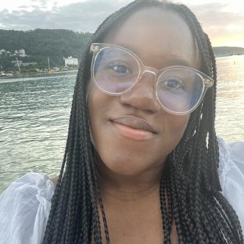 Selfie of a person in front of a body of water